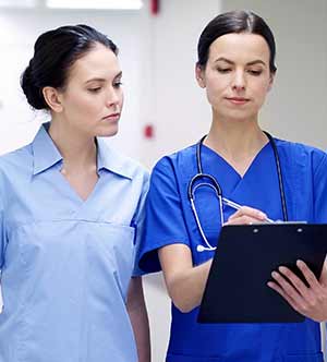 Nurses sharing important information Nurses sharing important information