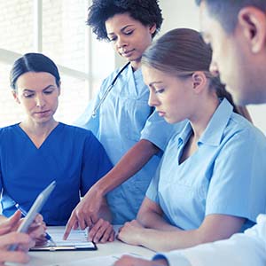 Group of Nurses discussing a CEU course Group of Nurses discussing a CEU course